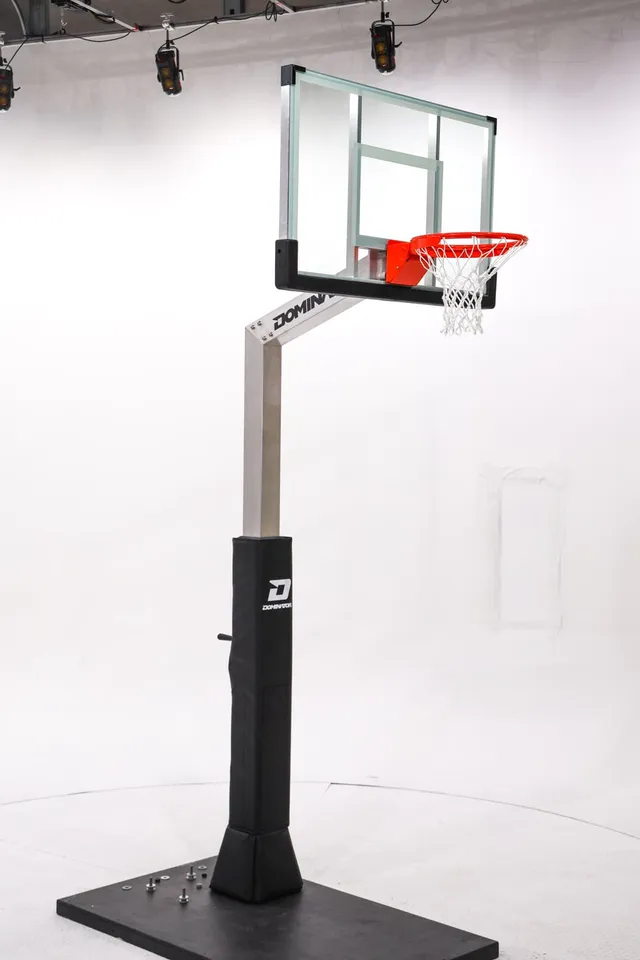 The 54 inch hoop photographed in a studio, standing on a temporary weighted base plate rather than the in-ground anchor it ships with.