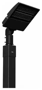 The single head pole in black powder coat, seen from the side with the LED head angled down from its tilt bracket.