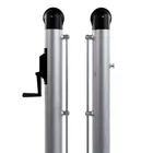 Both square posts standing with the net laced between them, showing the full system as it sits on a court.