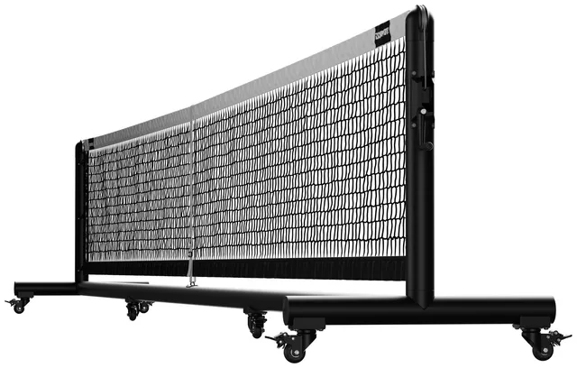 The Pro portable net in black powder coat, seen at an angle across its full width, with the winder handle on the near post and locking casters under both feet.