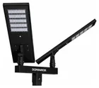 Two black solar fixtures on a black crossbar, the panel faces up and the Dominator name across the bar.